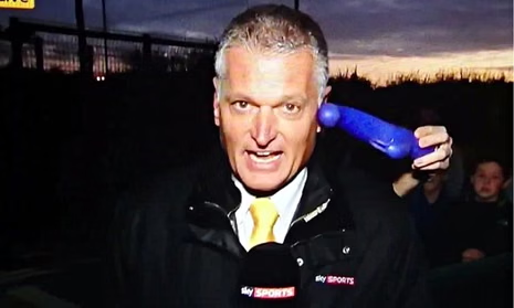 Journalists covering football transfer deadline day inside a busy newsroom
